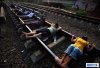 bvillagers_in_indonesia_have_resorted_to_lying_on_train_t_9.jpg